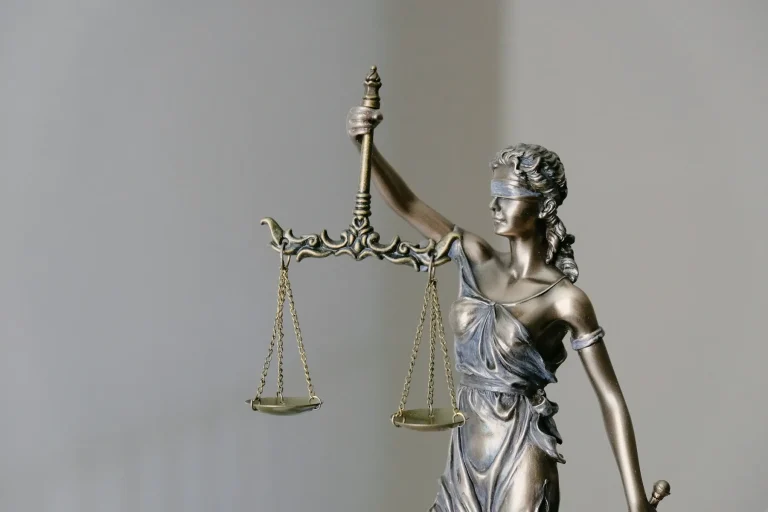 Bronze statue of Lady Justice holding scales